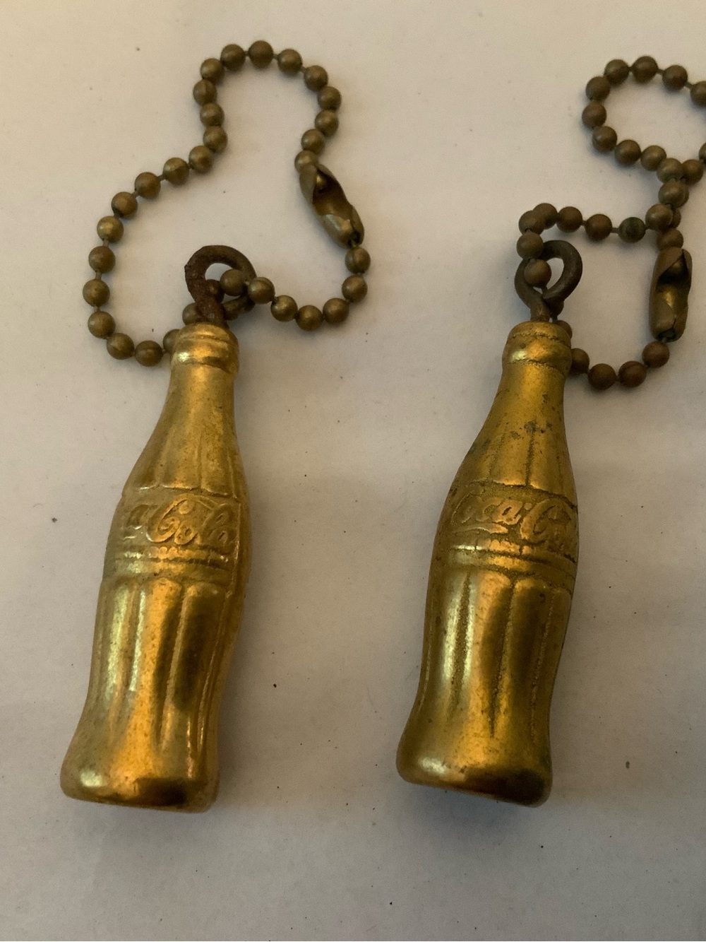 Pair of Coca-Cola Gold Bottle Keychains